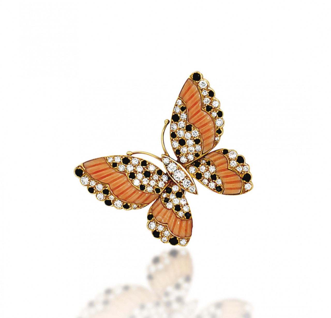 2013_CKS_01163_0319_000(a_coral_onyx_and_diamond_brooch_by_van_cleef_arpels072328)(1).jpg